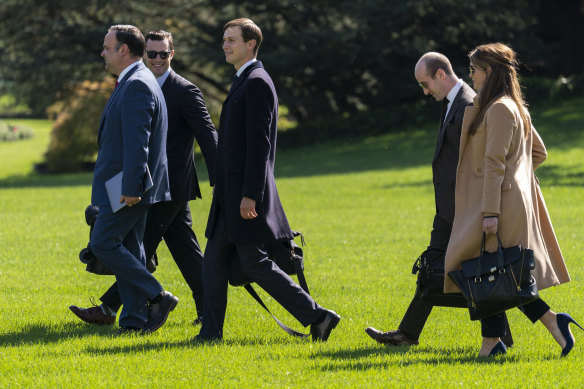 From left, deputy chief of staff for communications Dan Scavino, director of Oval Office operations Nicholas Luna, senior adviser Jared Kushner, senior adviser Stephen Miller and counsellor Hope Hicks walk to board Marine One with President Donald Trump on Wednesday. Hicks tested positive before Trump and first lady Melania.