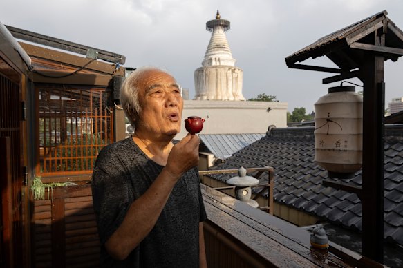 From the rooftops near Beijing’s White Pagoda Temple, Li blows a pigeon whistle he crafted himself.