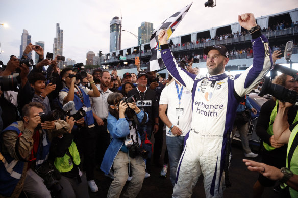 Shane van Gisbergen celebrates his NASCAR victory.