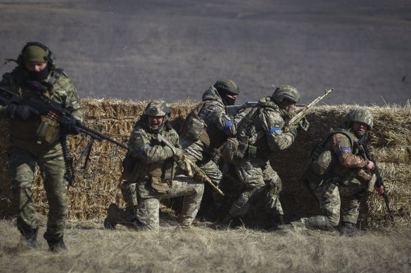 Units of one of the territorial defence brigade participate in military drills on a training ground in Zaporizhzhia region, Ukraine, on Tuesday.