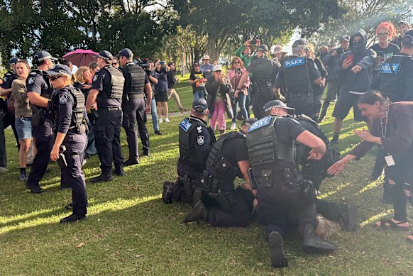 Police clashing with protesters at the park on Friday.
