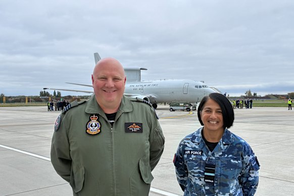Wing Commander Samuel Thorpe and Air Vice-Marshal Di Turton in front of the Wedgetail aircraft that will return from its deployment in Poland.