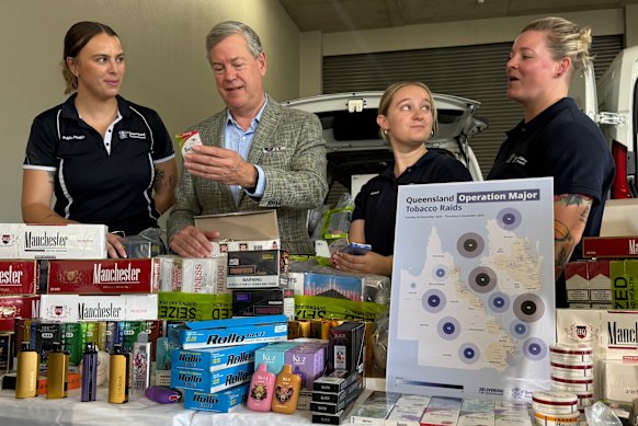 Queensland Health Minister Tim Nicholls inspects some of the illegal goods seized during the 10-day blitz.