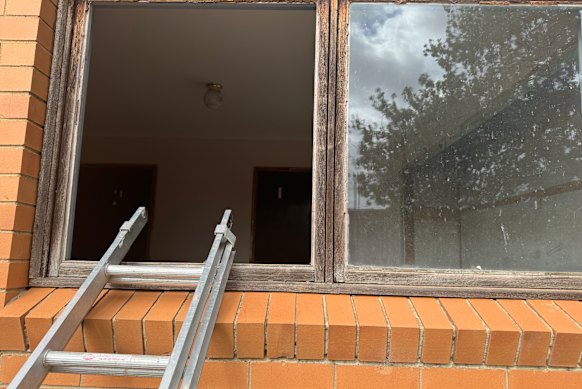 Lisa Woodall says she discovered this ladder propped against the window of her late parents’ house when she visited 10 days before settlement.