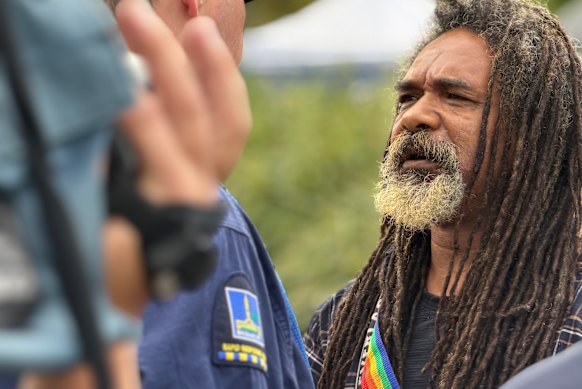 A Brisbane City Council worker negotiating with Uncle Derek Oram at Victoria Park.