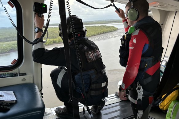 A Rescue 500 helicopter crew prepares to take the man to Gold Coast University Hospital.