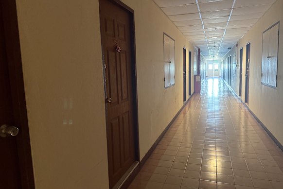 The door to the room where residents say Simon Peter Carman had been staying.