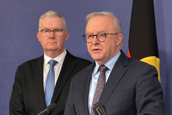Home Affairs Minister Tony Burke and Prime Minister Anthony Albanese speak to the media on Monday night.