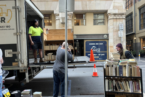 Removalists at the City Library taking away a truckload of books. 