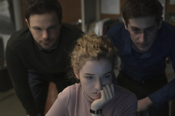 Julia Garner plays a woman whose co-workers keep the boss' dirty secrets safe in The Assistant.