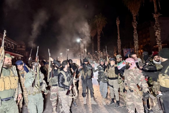 Rebel forces led by HTS in the city centre of Homs.