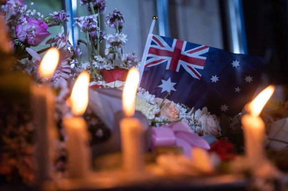 An Australian flag is seen during the commemoration in Bali.