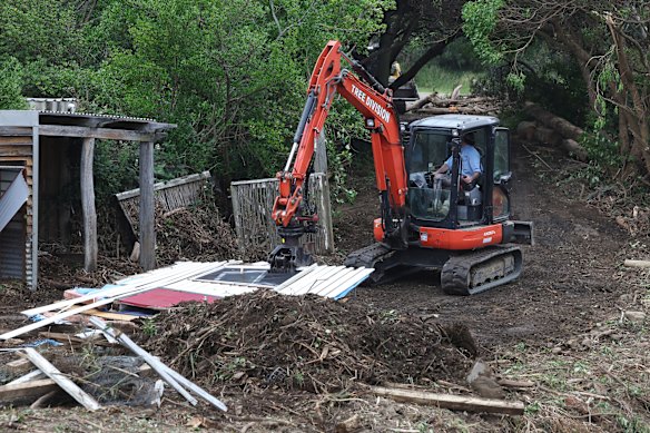 After the flood: the cleanup under way at Separation Creek. 