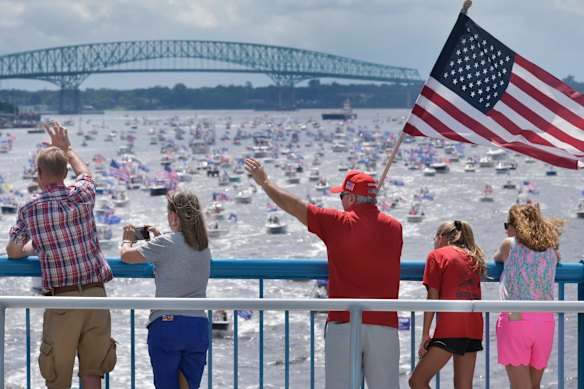 Trump supporters wave at hundreds of boats on the St Johns River in Florida to celebrate Trump's 74th birthday.