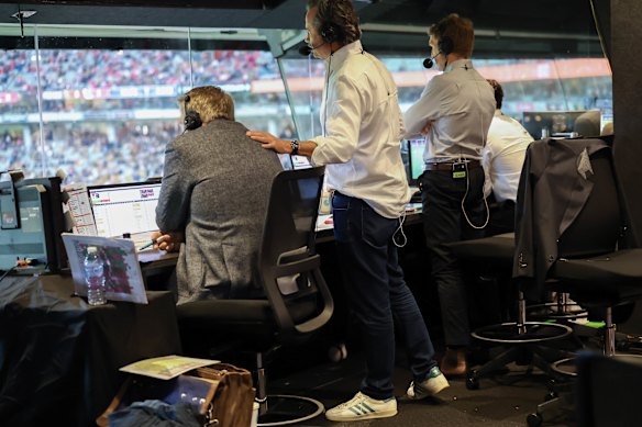 Sevens key commentators, Brian Taylor, Hamish McLachlan, Kane Cornes and Luke Hodge, in the commentary box calling the match. 