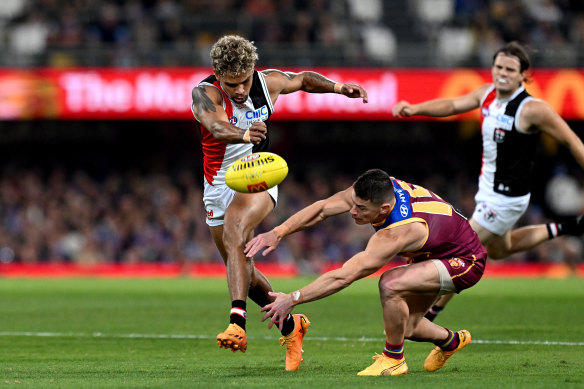 Liam Henry of the Saints gets a kick away.