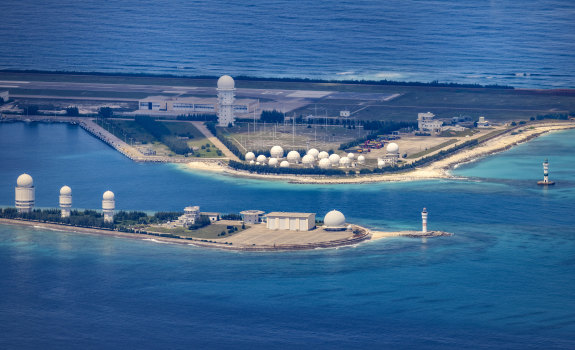 An airfield, buildings, and structures are seen on the artificial island built by China in Fiery Cross Reef on October 25, 2022 in Spratly Islands, South China Sea.