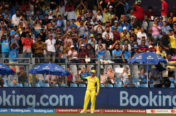 David Warner acknowledges the crowd during Australia’s World Cup match against Afghanistan in Mumbai.