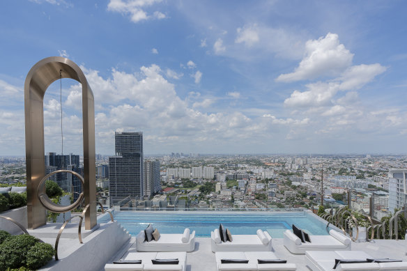The rooftop pool, sun lounges and an extraordinary swing.