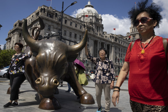 The Bund Bull in Shanghai, China’s financial centre. Wall Street banks are rushing in to China, but are still struggling to make money.