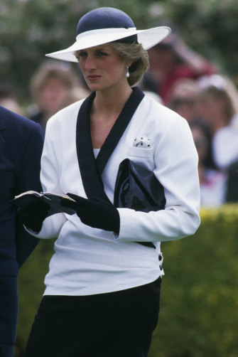 Diana paired her navy and white Bruce Oldfield suit with a hat by Australian-born milliner Freddy Fox. 