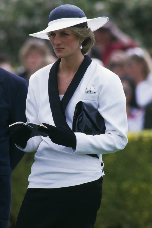 Diana paired her navy and white Bruce Oldfield suit with a hat by Australian-born milliner Freddy Fox. 