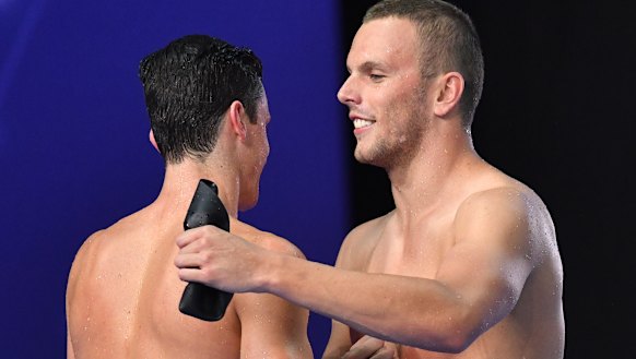 Kyle Chalmers celebrates winning the final over Jack Cartwright (left).