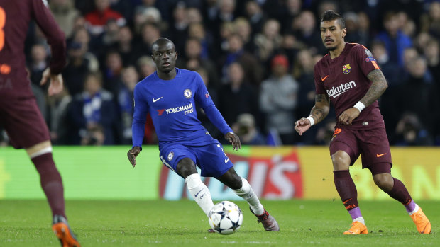 Feared the worst: Chelsea's N'golo Kante fights for the ball with Paulinho of Barcelona.