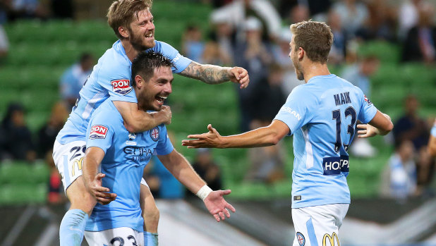 Big blue: Stefan Mauk of Melbourne City celebrates his goal against the Wanderers with provider, Bruno Fornaroli.