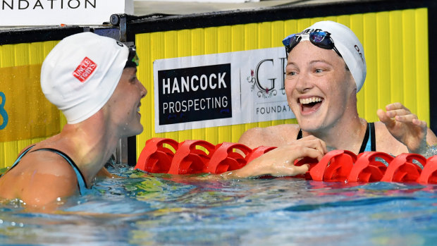 Cate Campbell (right) looks on to sister Bronte after winning the womens' 100m freestyle final.