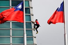 Rock climber Alex Honnold performs a free solo climb of the Taipei 101 skyscraper. 
