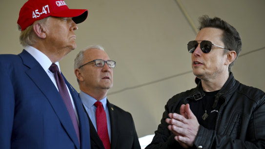 President-elect Donald Trump speaks with Elon Musk as Senator Kevin Cramer listens, before viewing the launch of a SpaceX test flight in Brownsville, Texas, in November.