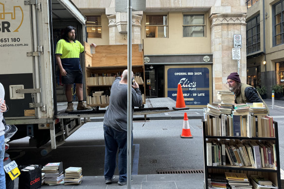 Removalists at the City Library taking away truckloads of books. 