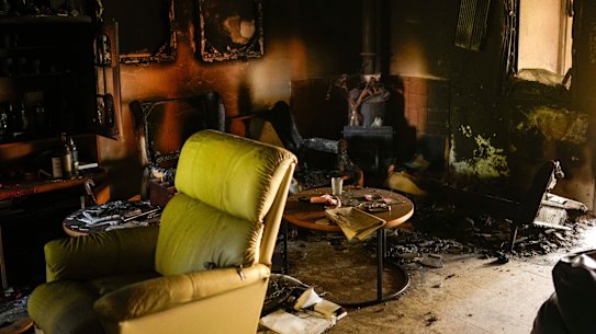 Destroyed furniture and charred walls are seen in a home that came under attack during a Hamas invasion into Kibbutz Nir Oz.