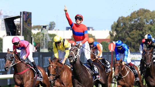 James McDonald salutes on Verry Elleegant as Addeybb and Tom Marquand (yellow silks) finish second.
