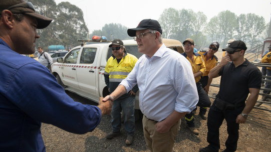 Prime Minister Scott Morrison meets NSW Rural Fire Service volunteers in the Blue Mountains on December 23.