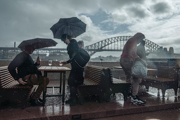 A lengthy stretch of showery days along the eastern seaboard is currently being experienced as people battle a dump of rain at the Opera House.