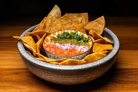 Guacamole striped with chopped red onion, coriander and green chillies.