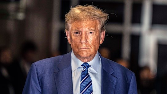 Former US president Donald Trump leaves court on the second day of his hush money criminal trial in Manhattan.