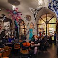 Bar Ampere's concrete tunnel swept with bohemian artworks.