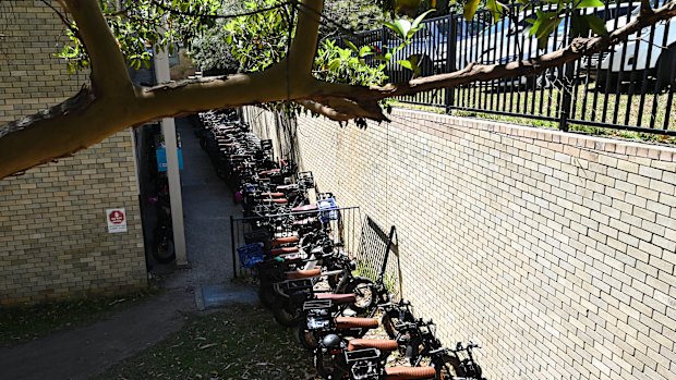 E-bikes fill the laneway at Mackellar Girls High School. 