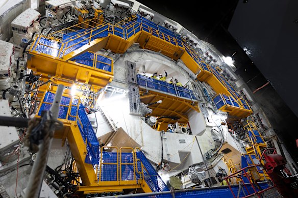 Workers in the centre of one of the two giant tunnel boring machines gives a sense of its size.