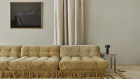 An original 1970s French sofa has been reupholstered in plush velvet and trimmed with cord.