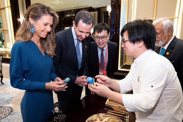 Bashar al-Assad and his wife Asma enjoy a demonstration of intangible cultural heritage before a welcoming banquet in China last year.