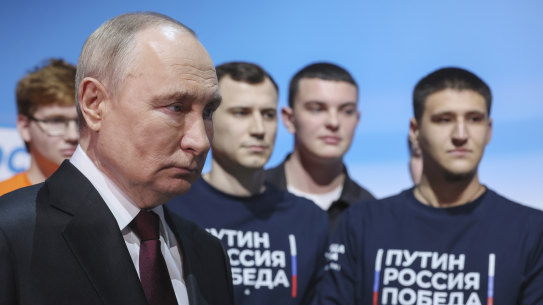 Russian President Vladimir Putin visits his campaign headquarters after a presidential election in Moscow.