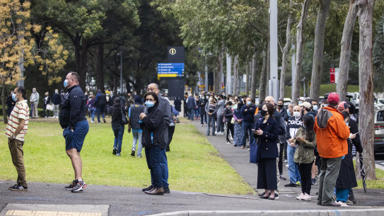 People queue to vaccinate at the NSW Vaccination Centre in Homebush.