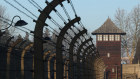 A guard tower stands among barbed wire at the Auschwitz I former concentration camp site in Oswiecim, Poland.