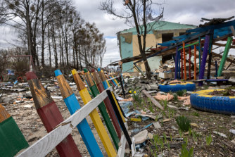 A smashed fence stands outside a kindergarten that was bombed during the Russian invasion west of Kyiv.