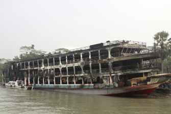 The burnt passenger ferry is anchored off the coast of Jhalokati district on the Sugandha River in Bangladesh.