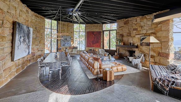 The floors in the old house are terrazzo. Its new floors are a combination of polished concrete embedded with large slabs of terrazzo, in varying hues.